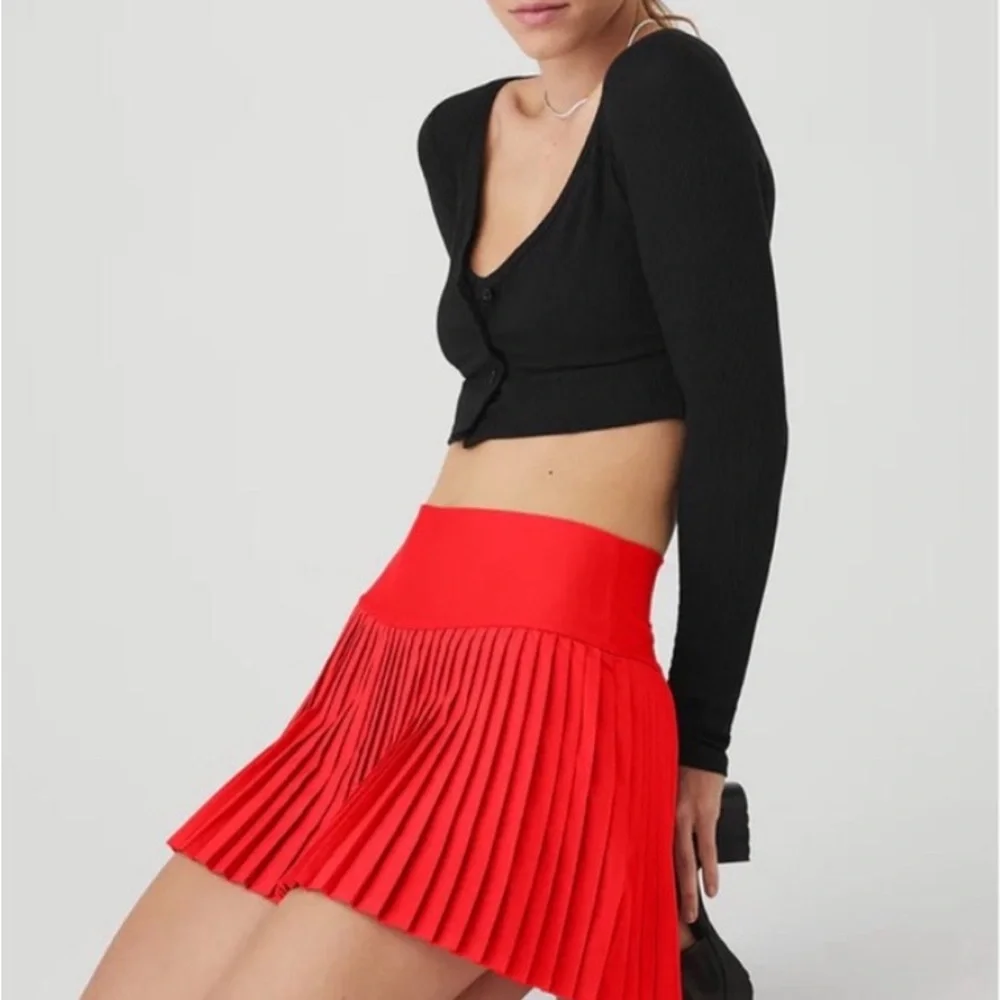 Red pleated also tennis skirt